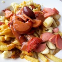 Poutine with Hot Dog in Montreal Canada