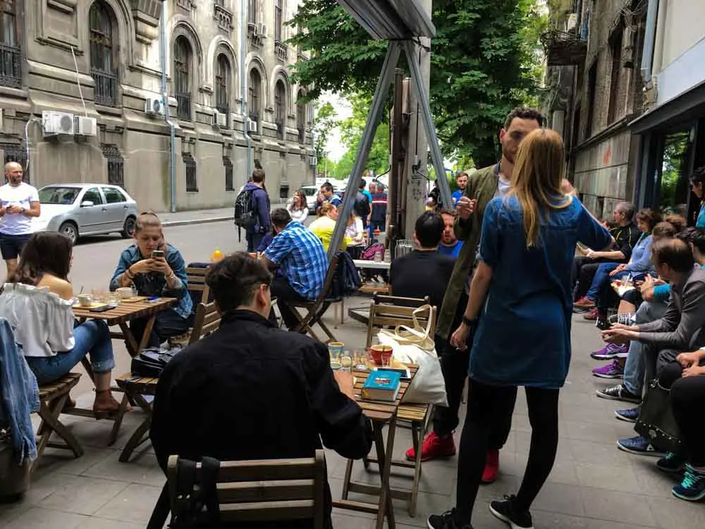 Origo Coffee Sidewalk Scene in Bucharest Romania