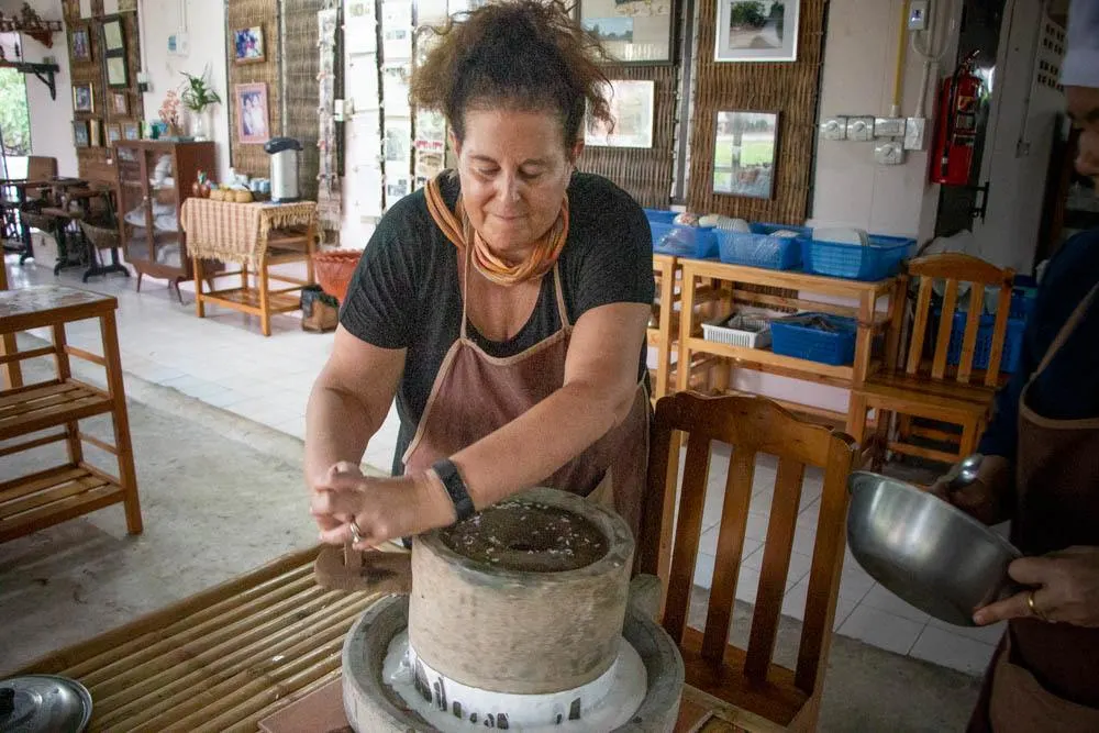 Mindi Grinds Rice at Love Chiang Mai Cooking Class