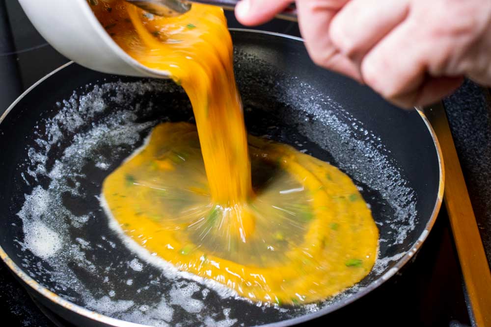 Pouring Eggs into the Pan