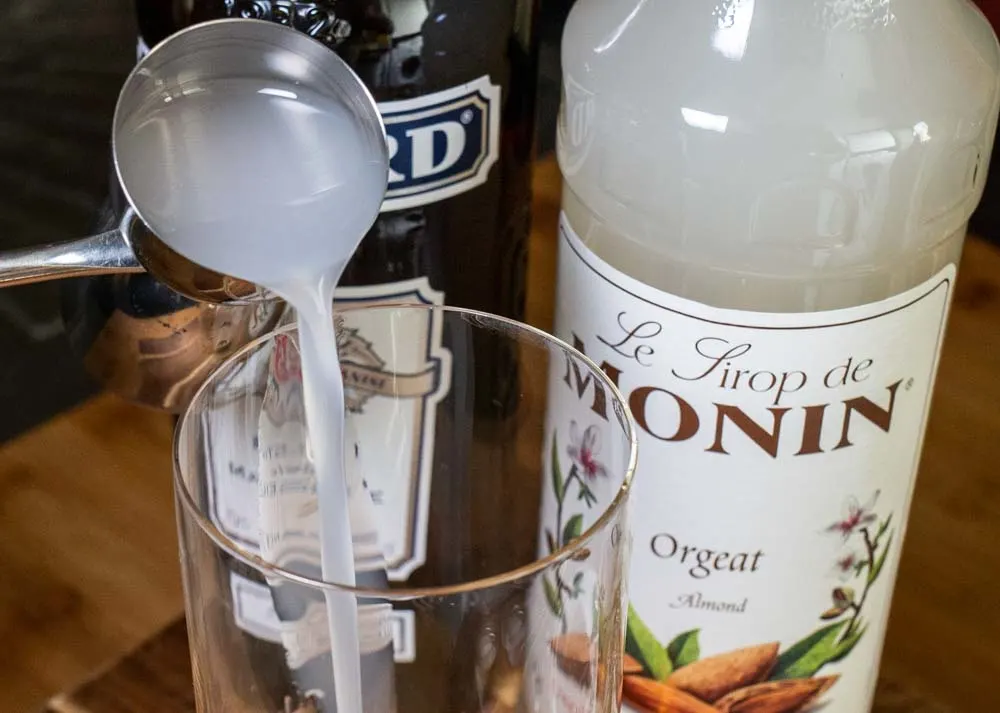 Pouring Orgeat for Mauresque Cocktail