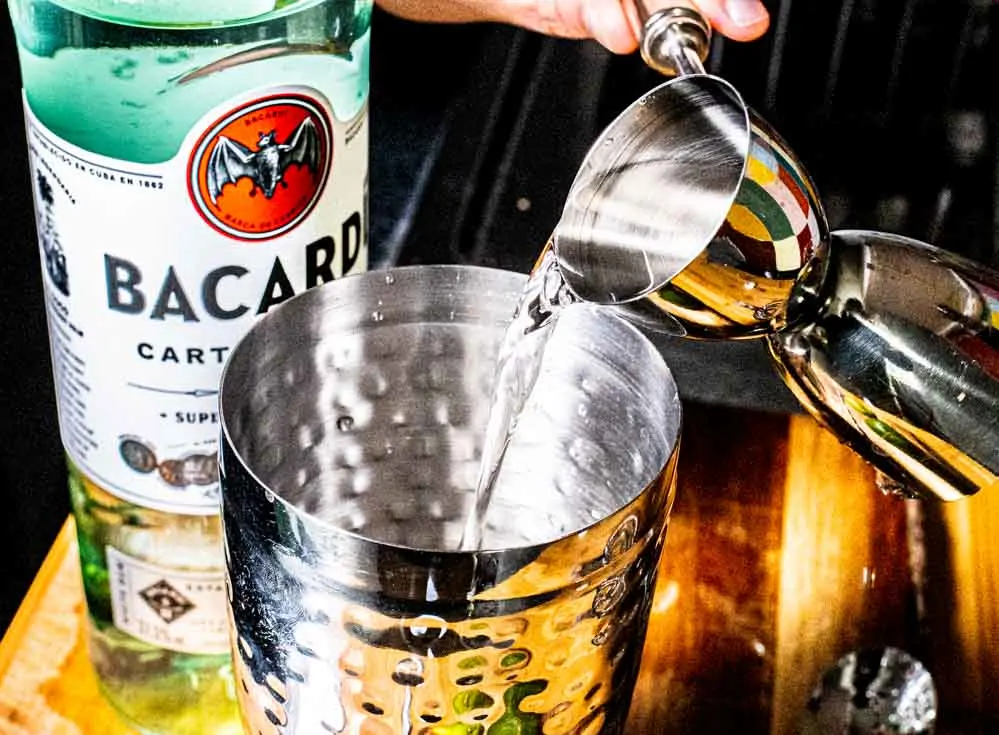 Pouring Bacardi Rum into Daiquiri