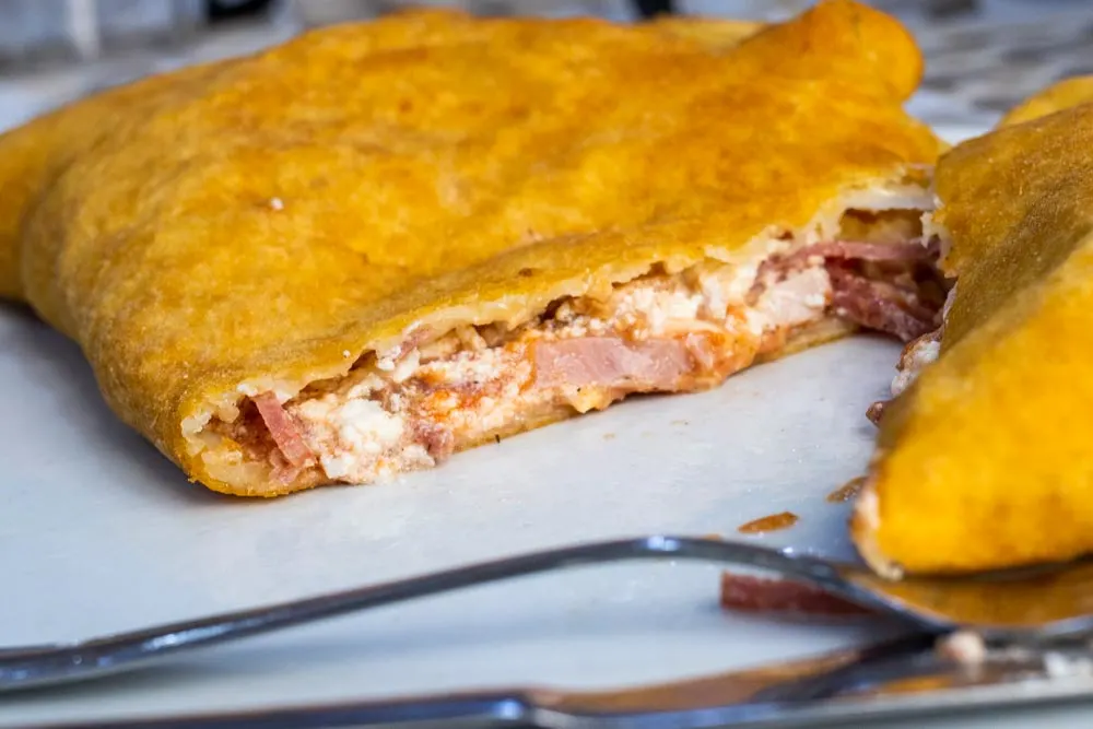 Fried Pizza with Fork at Pizzeria Tutino in Naples