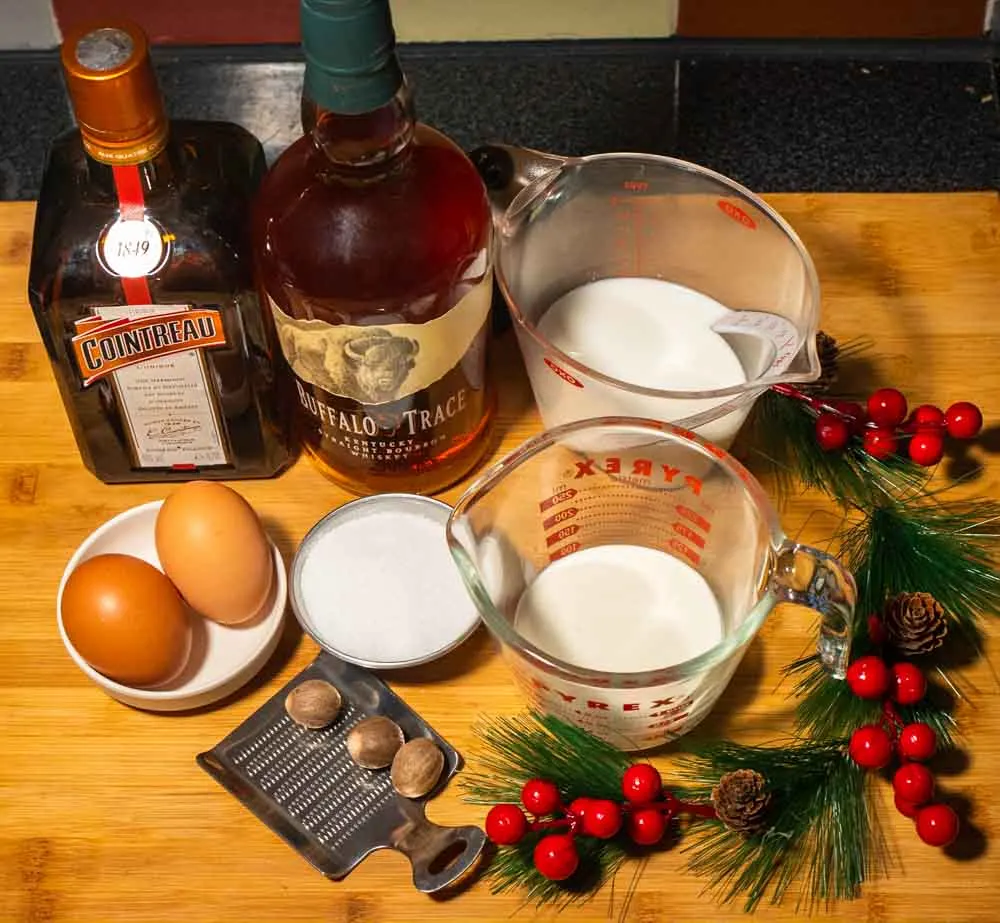 Bourbon Eggnog Ingredients - Cointreau, Bourbon, Whole Milk, Heavy Cream, Sugar, Eggs and Nutmeg