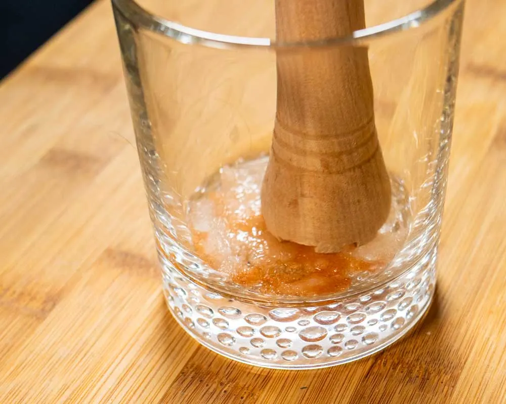 Muddling Old Fashioned in Glass