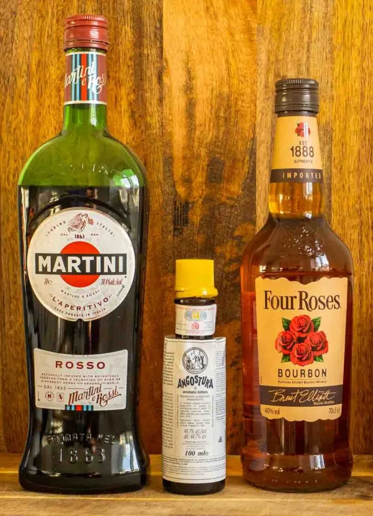 Bottles of Sweet Vermouth, Bitters and Bourbon