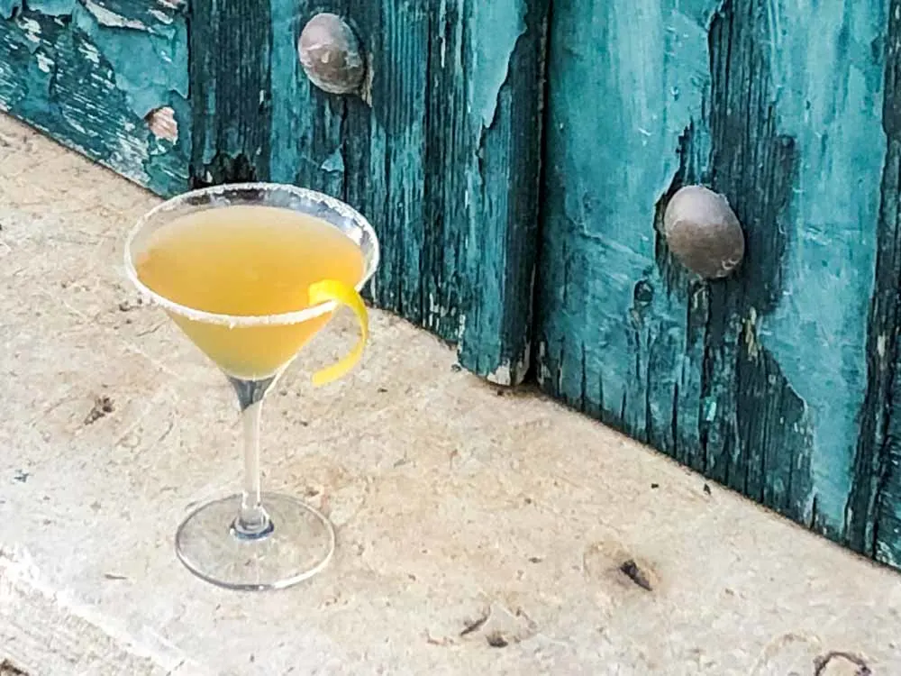 Bourbon Sidecar Cocktail Next to Green Door