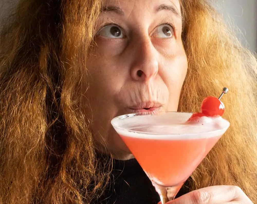 Mindi Drinks a Pink Lady Cocktail