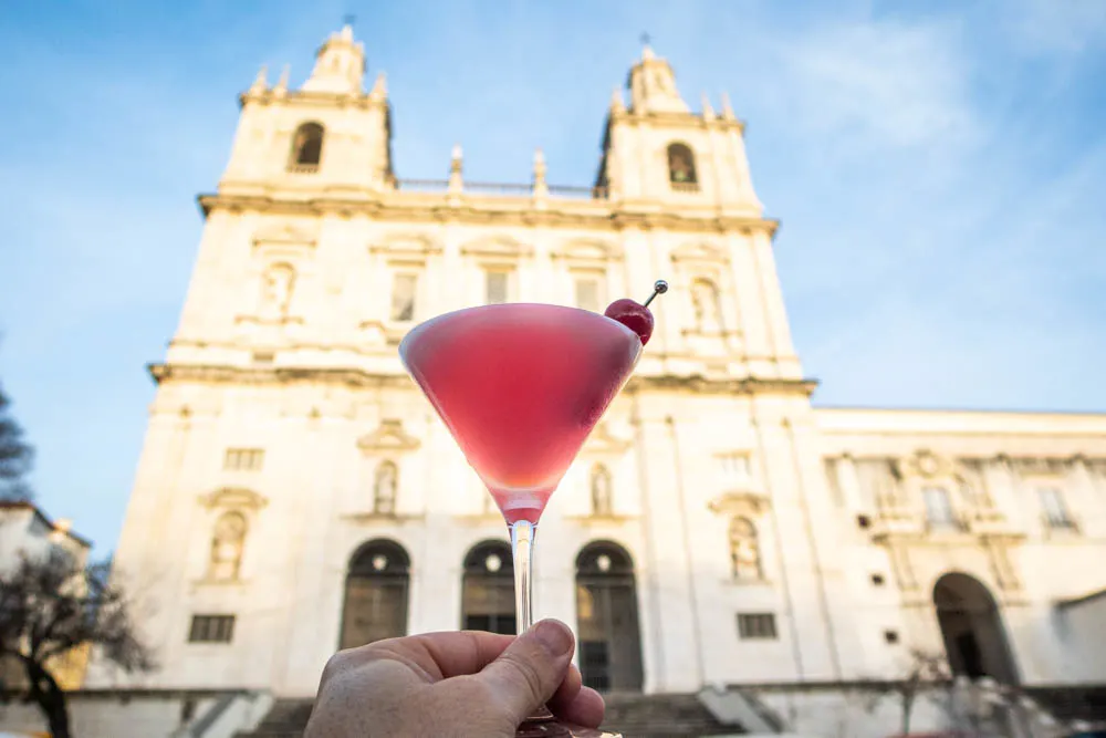 Pink Lady Cocktail in front of Lisbon Cathedral