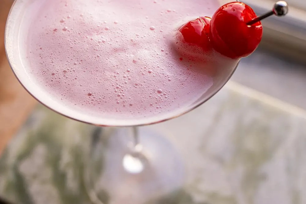 Pink Lady Cocktail with 3 Cherries