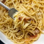 Spaghetti alla Gricia on White Plate with Fork
