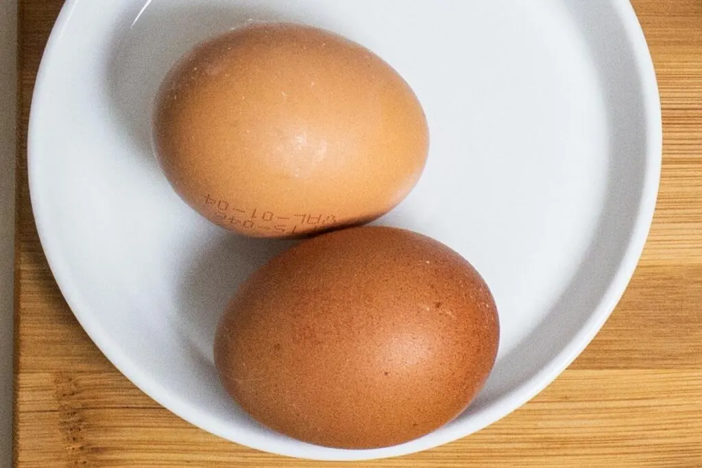 Two Eggs on White Plate