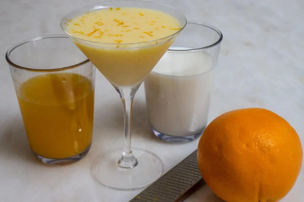 Orange Creamsicle Cocktail with Orang Juice, Milk and Orange