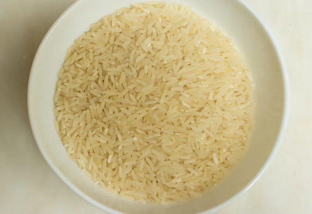 Uncooked Rice in White Bowl