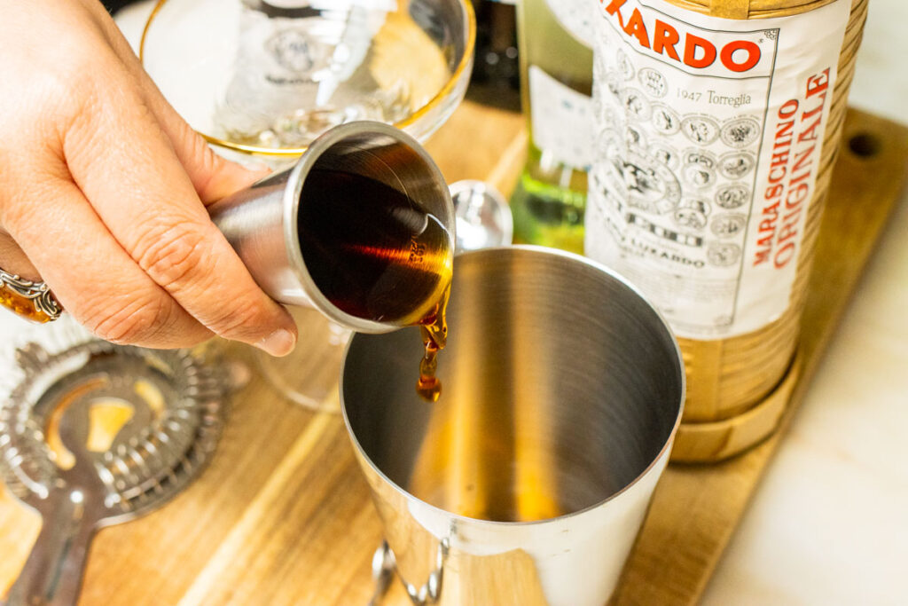 Pouring Sweet Vermouth into Diplomat Cocktail