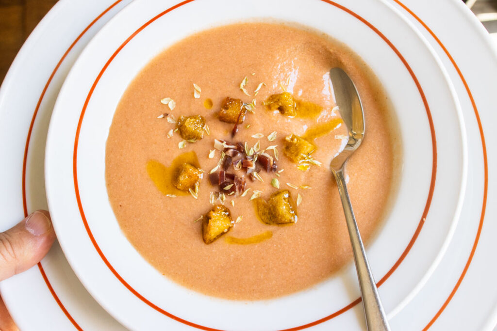 Gazpacho soup with submerged spoon