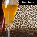 Pinterest image: french 75 cocktail with caption reading "New Orleans Best Bars"