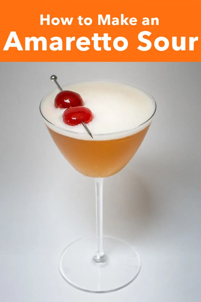 Pinterest image: photo of amaretto sour with caption reading "How to Make an Amaretto Sour"