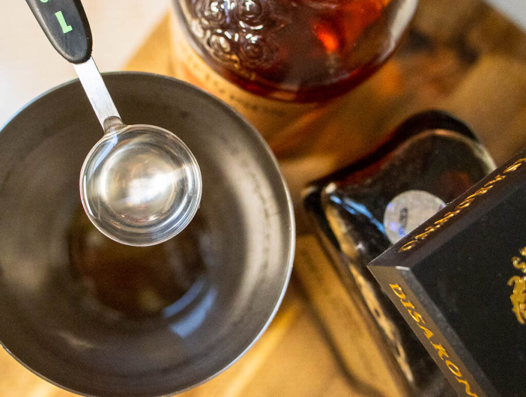 Measuring Simple Syrup for an Amaretto Sour