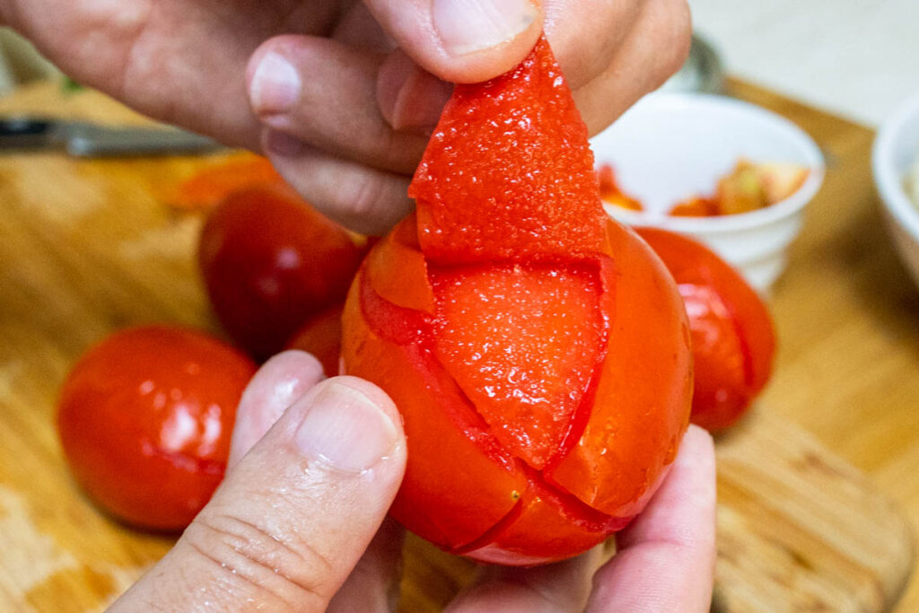 Peeling a Blanched Tomato for Tomato Sauce
