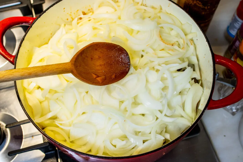Raw Onion added to Pot in Genovese Sauce