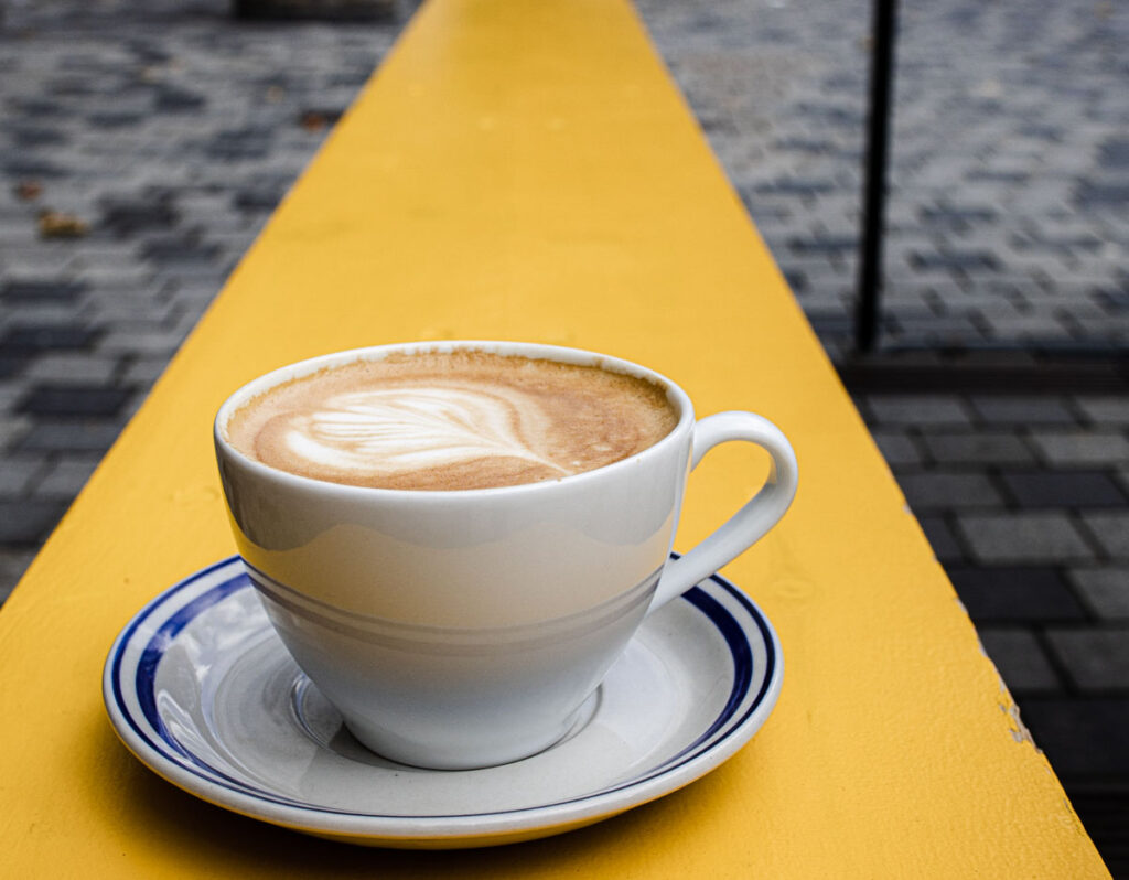 Coffee on Yellow Bench at Riccos Kaffe
