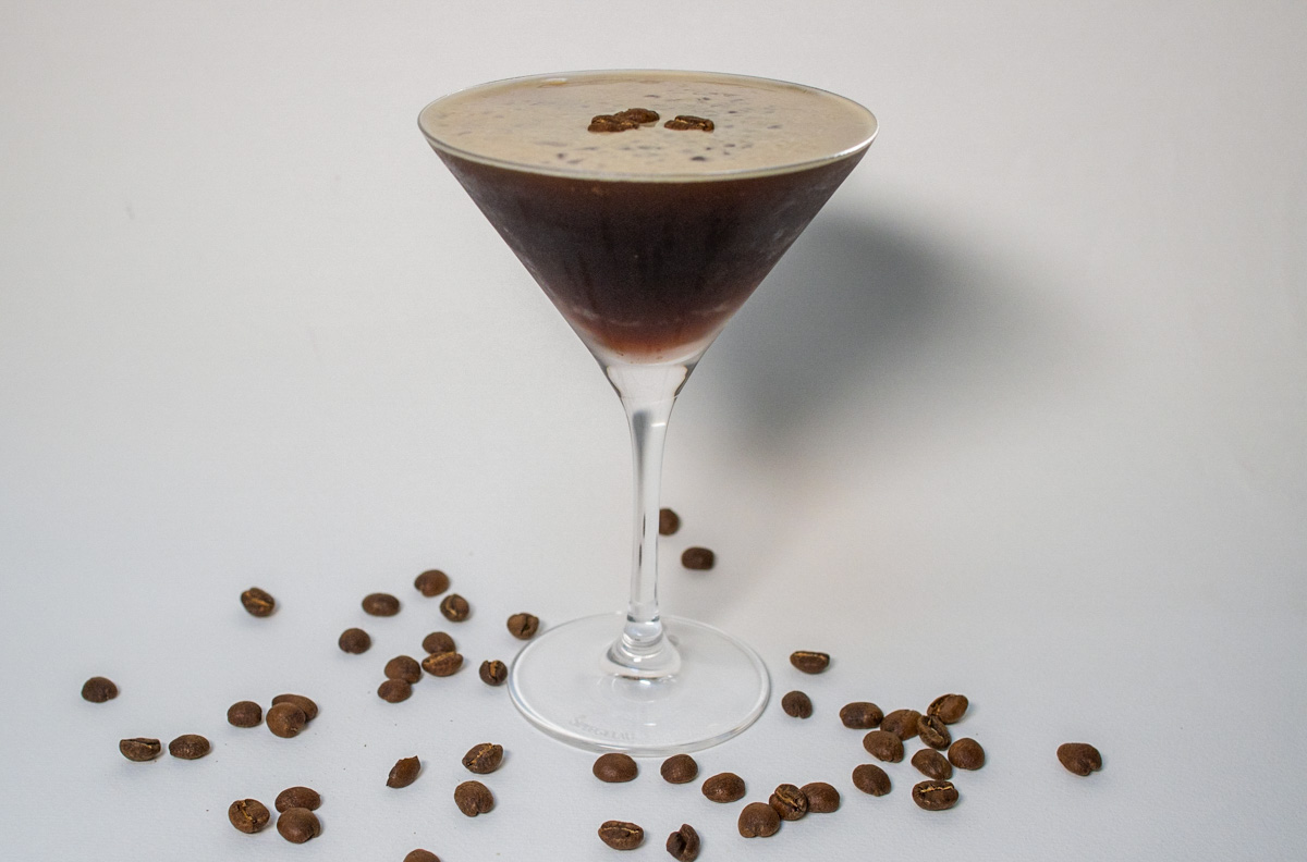 https://www.2foodtrippers.com/wp-content/uploads/2021/10/Espresso-Martini-Surrounded-by-Beans.jpg