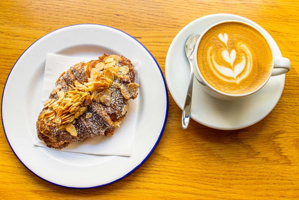Almond Croissant and Flat White at Democratic Coffee in Copenhagen