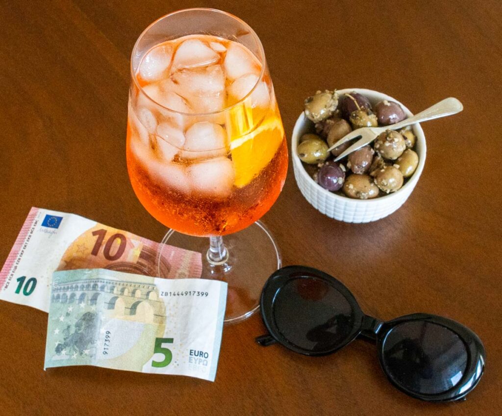 Apertol Spritz with Olives, Sunglasses and Euros