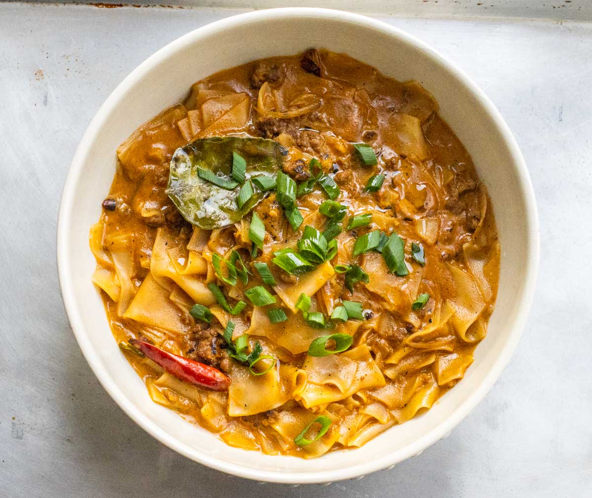 Thai Panang Curry Noodles with Meat Sauce on Silver Pan