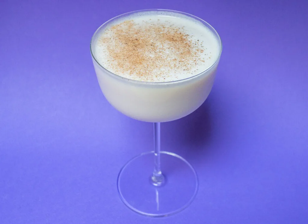 Bourbon Milk Punch from Above with Purple Background