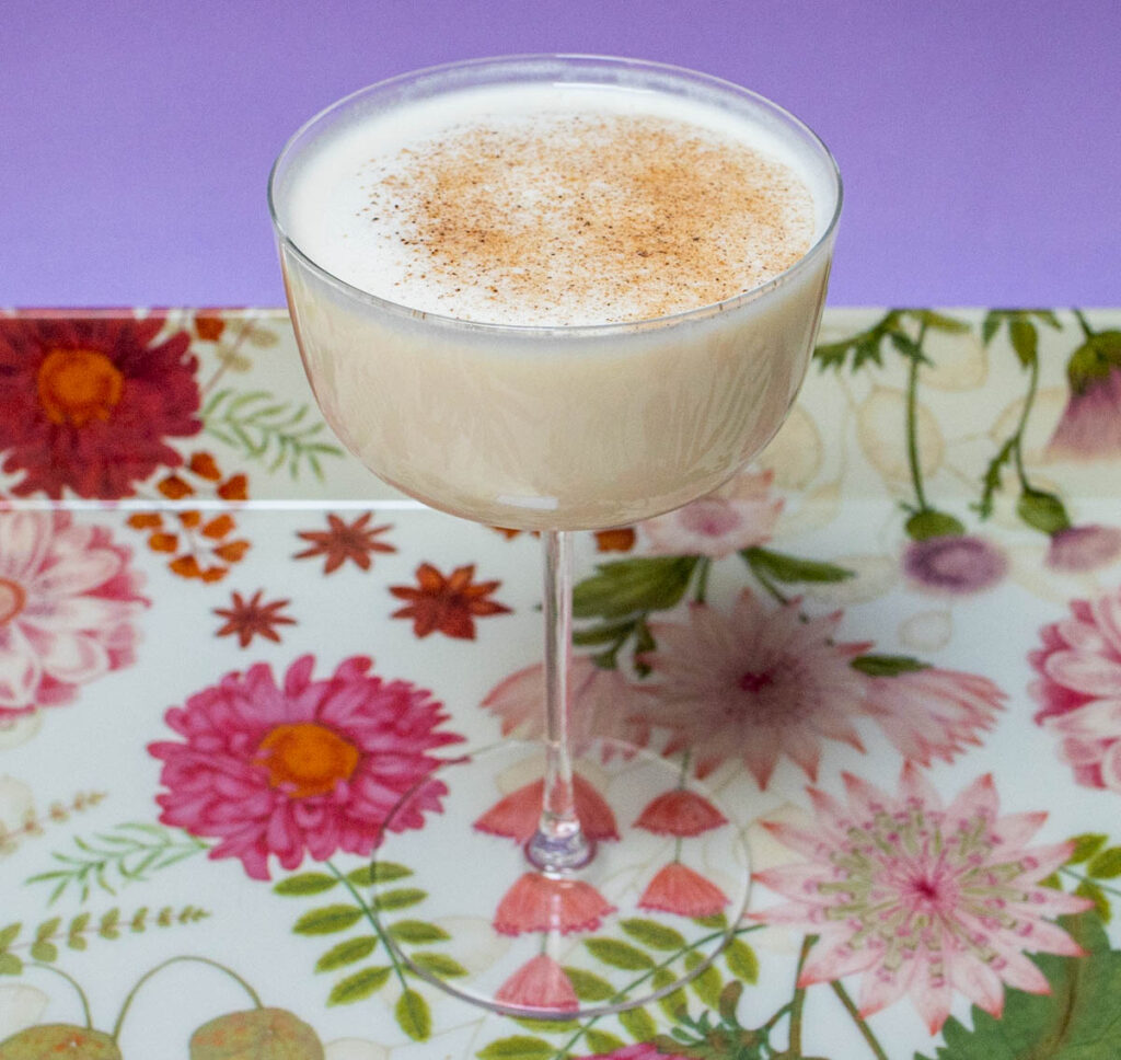 Bourbon Milk Punch on Floral Tray and Purple Background