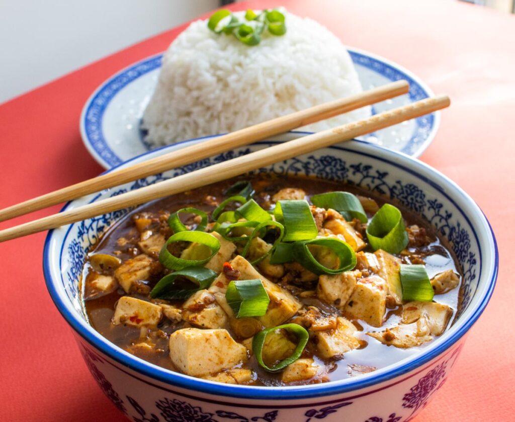 Mapo Tofu in Front of a Bowl of Rice