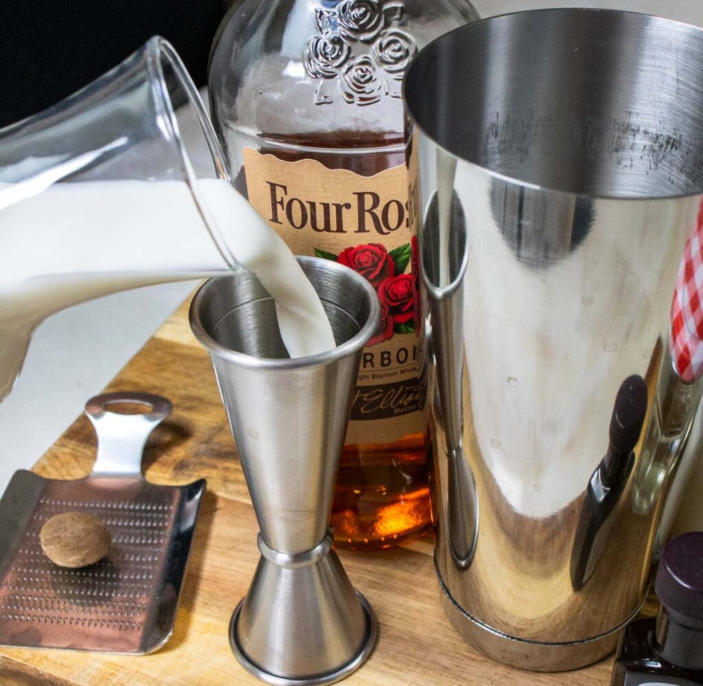 Measuring Cream for Bourbon Milk Punch Recipe