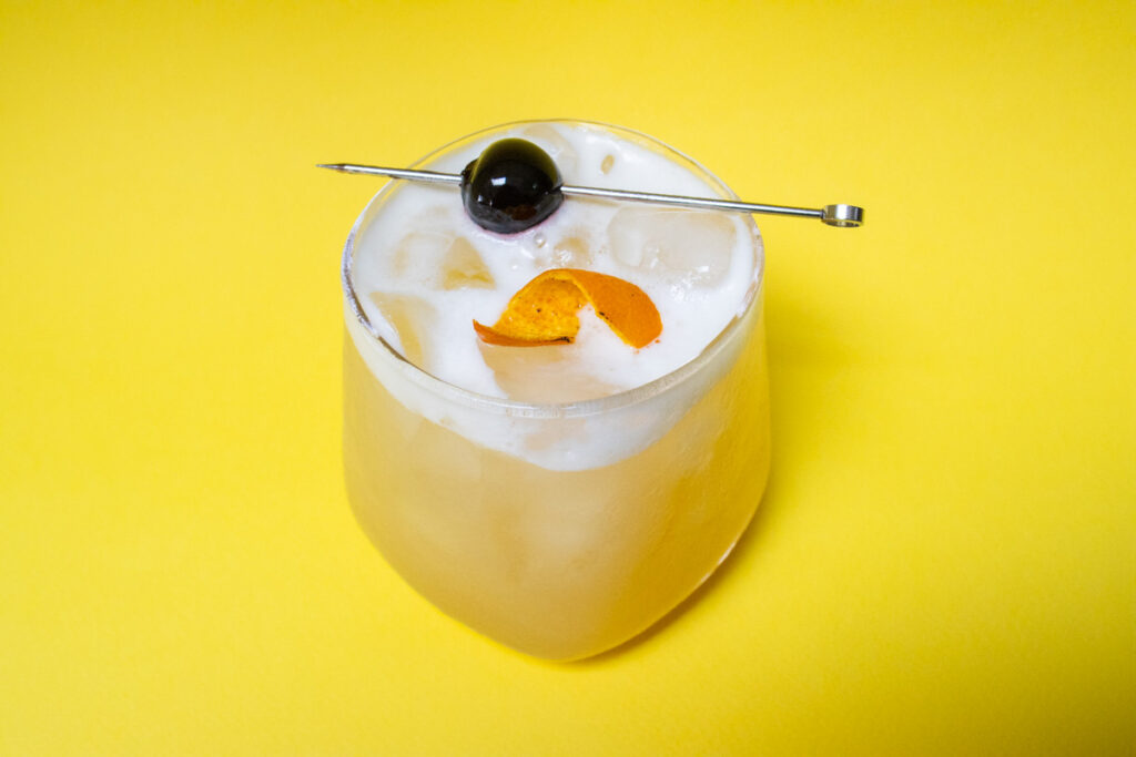 Whiskey Sour with Yellow Background from Above