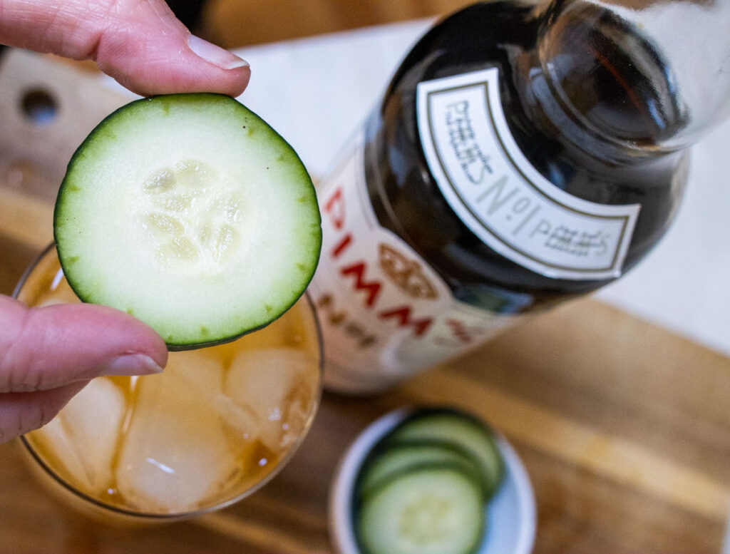 Adding Cucumber to Pimms Cup Cocktail