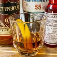 Crafted Sazerac Cocktail with Bottles