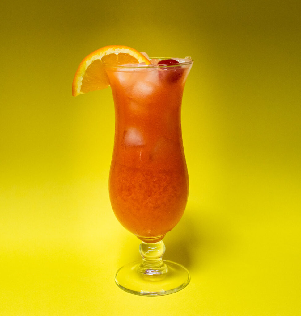Hurricane Cocktail with Yellow Background