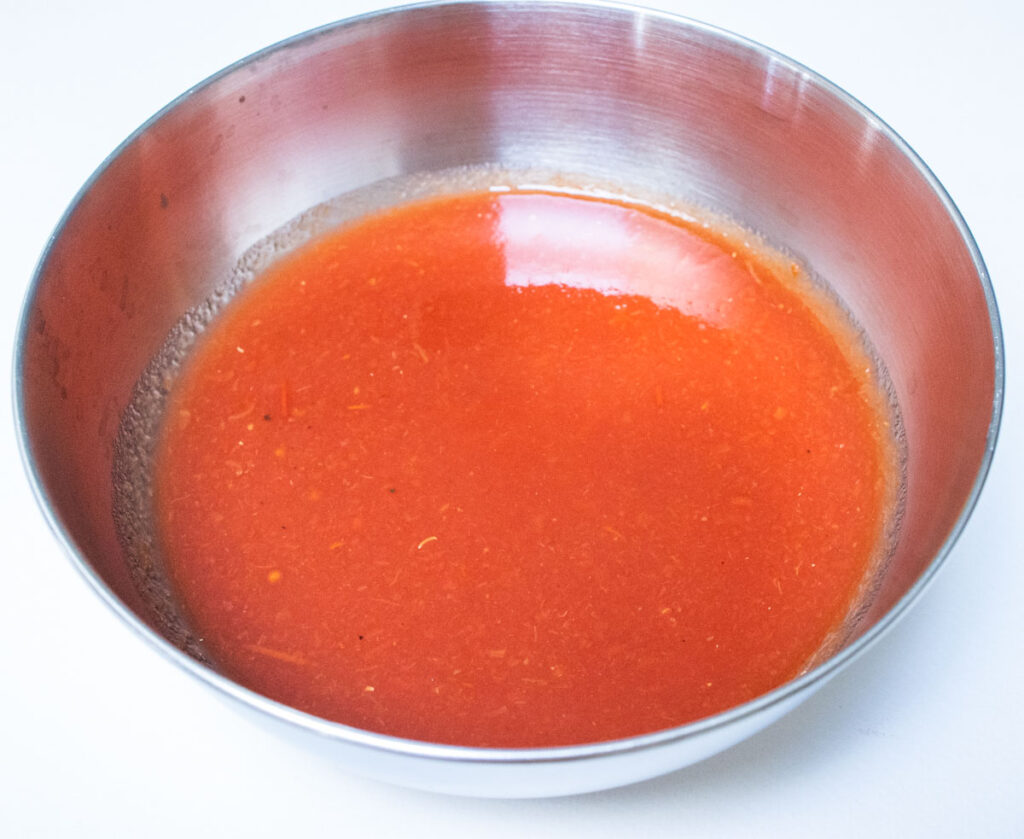 Tomato Puree Mixed with Water in a Bowl