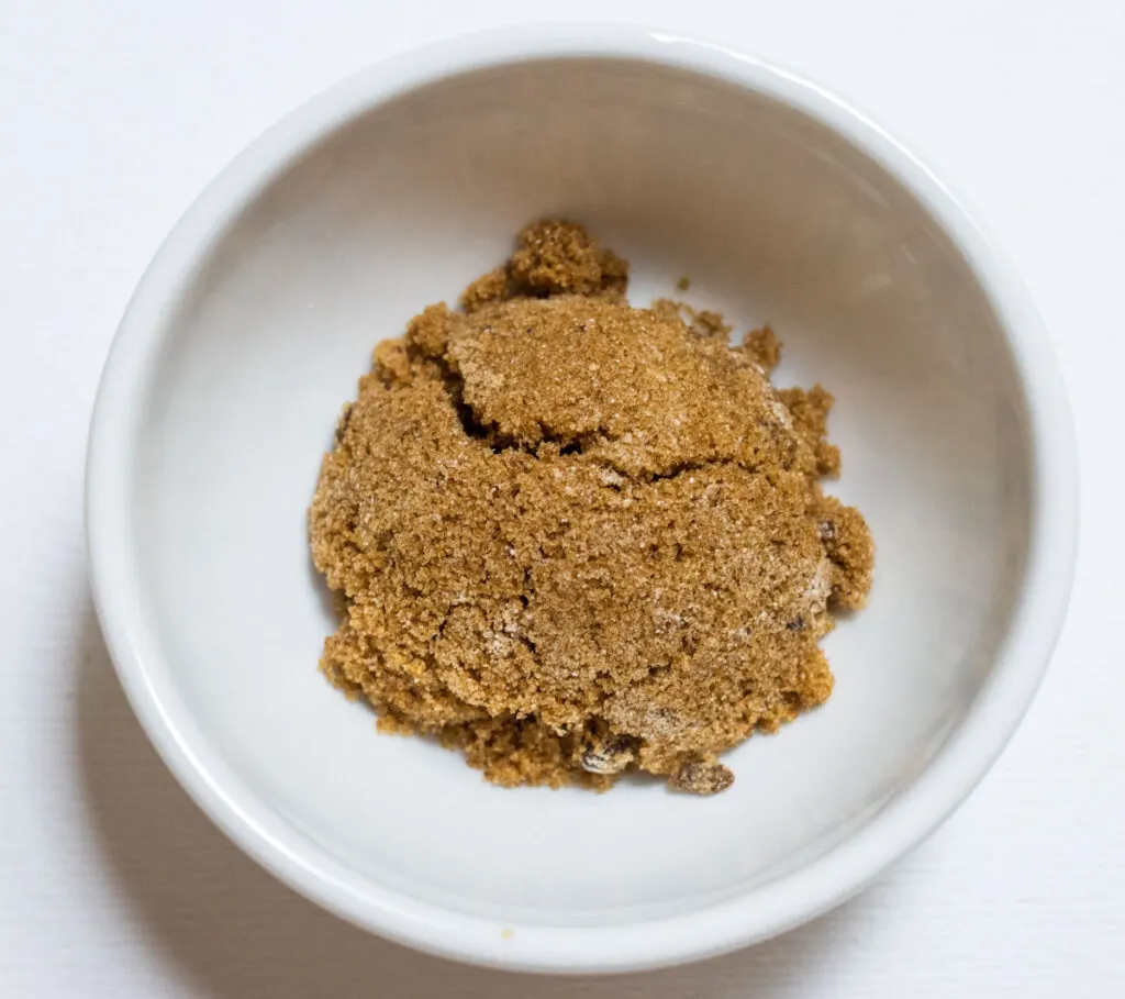 Brown sugar in a small white bowl
