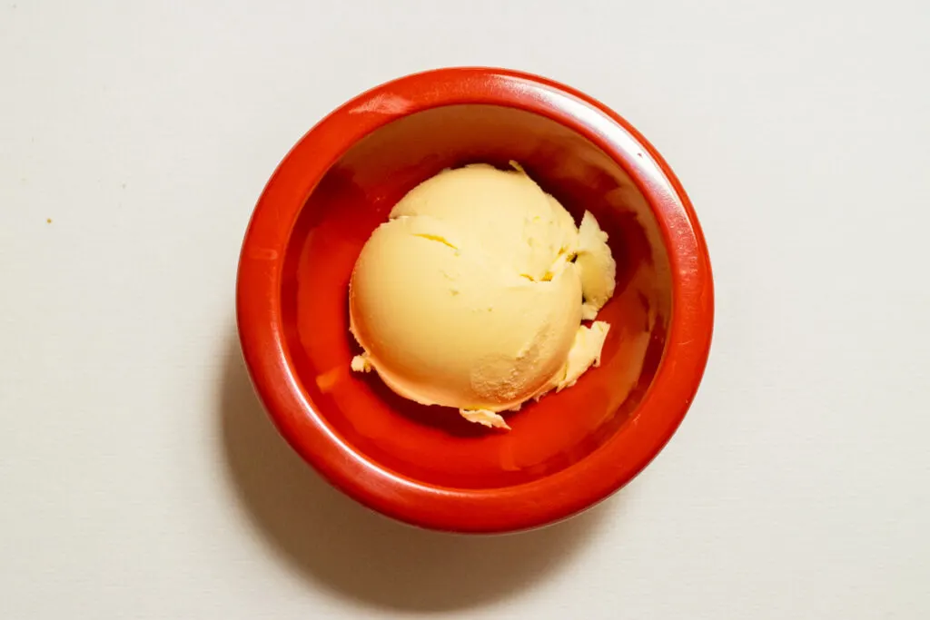 Butter in a small red prep bowl