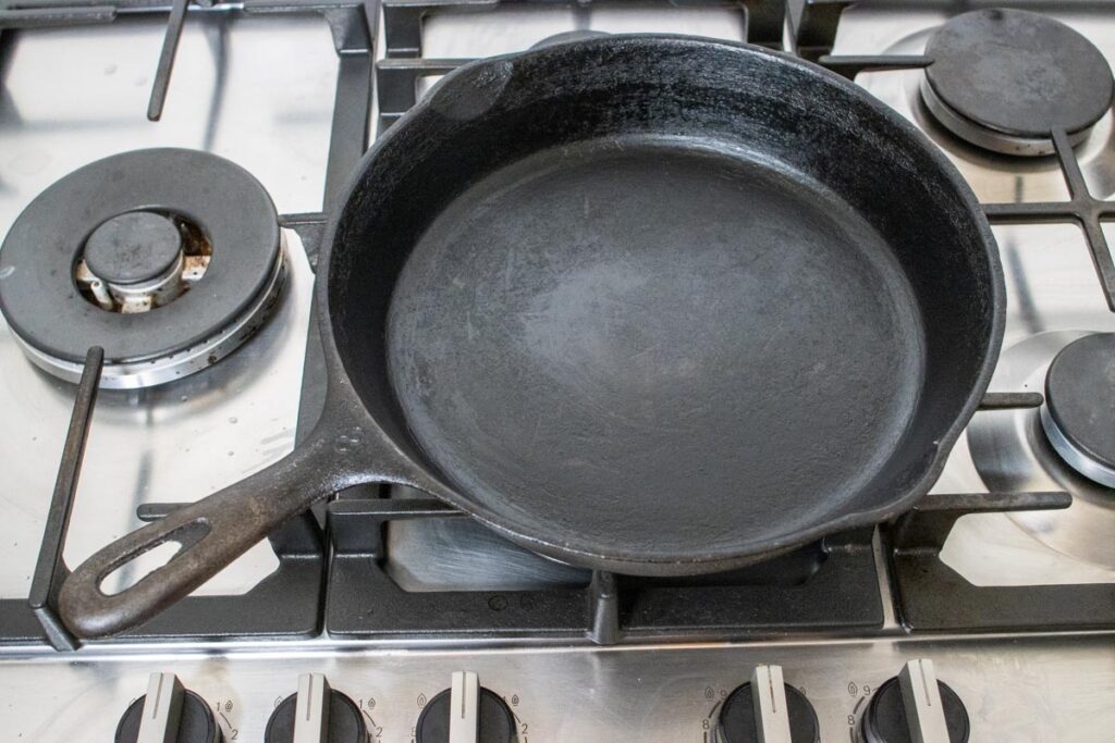 Empty cast iron pan on a stove