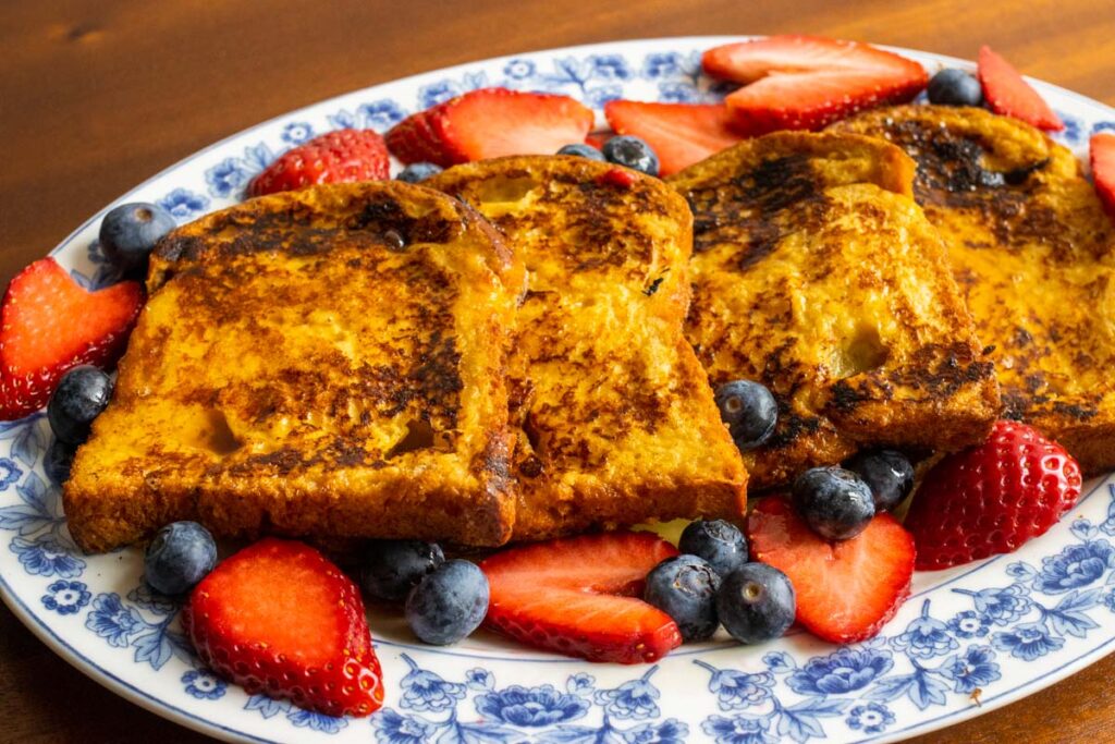 French toast on an oval plate - side view