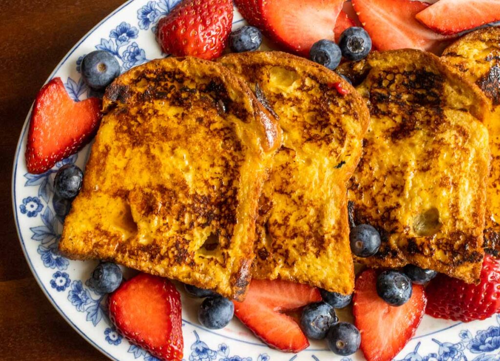 Overhead closeup of French toast on an oval plate