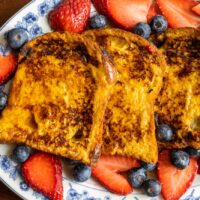 Overhead closeup of French toast on an oval plate