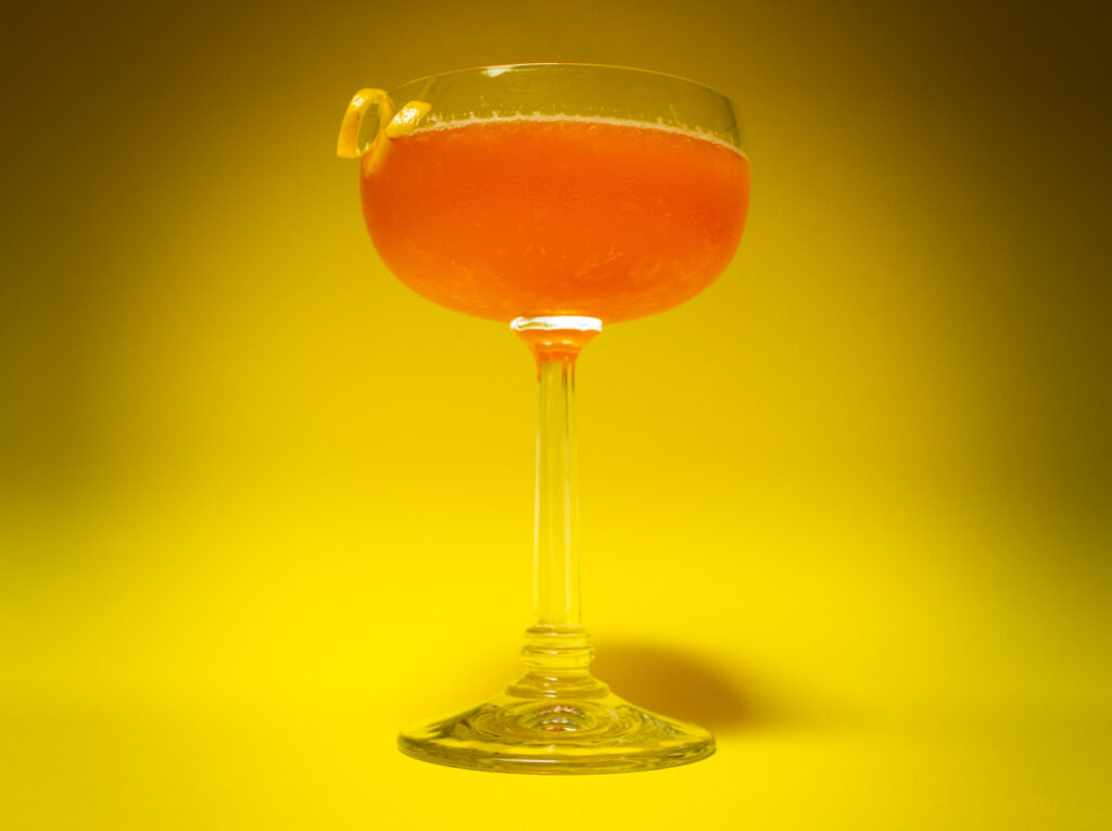 Paper Plane Cocktail with Yellow Background