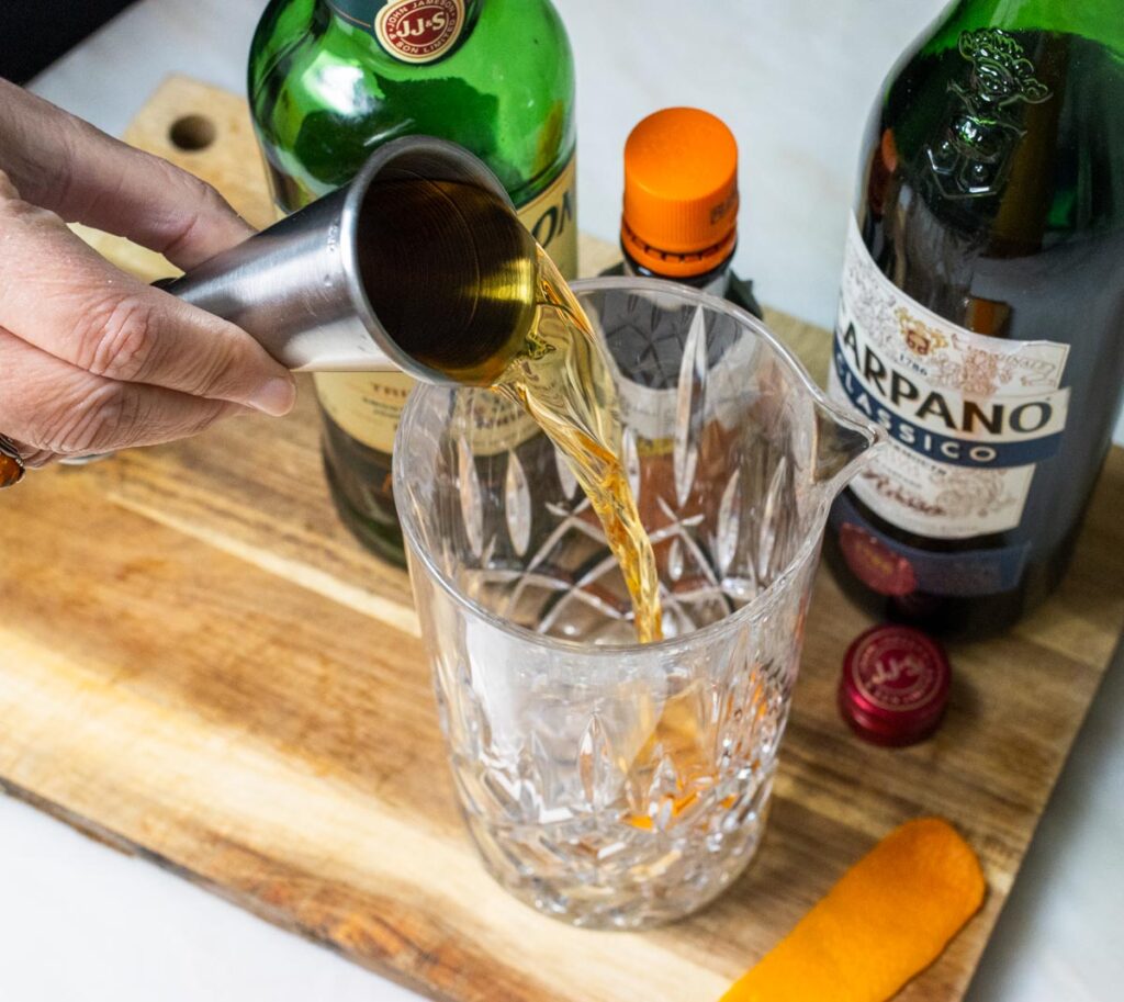 Pouring Irish Whiskey for an Emerald Cocktail