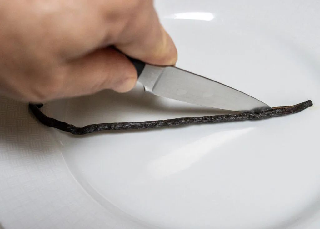 Splitting a vanilla bean with a paring knife