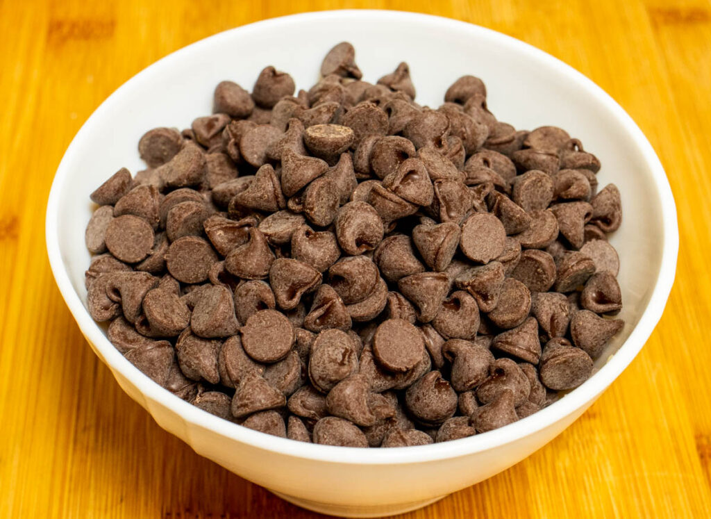 Chocolate chips in a white bowl