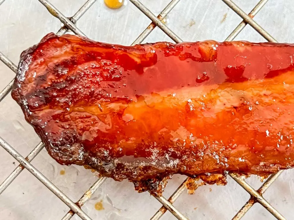 Close up of one strip of Maple Bacon with Brown Sugar